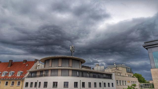 Thunderstorm clouds over roofs