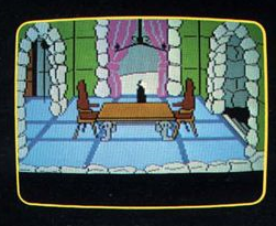 A scan of a screenshot from the King's Quest 2 box, showing the dining hall in Dracula's castle. The walls of the room are green rather than gray, and the table in the center of the room has a brown top and dark gray legs, which were switched in the final game. The candelabra is unlit in this screenshot. Dracula appears in the image, walking to the right (east) behind the dining table.