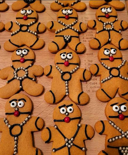 Gingerbread cookies that have bdsm gear on, complete with the mouth gags.