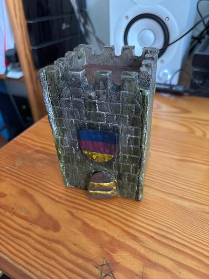 model of a medieval tower with flag of Transylvania