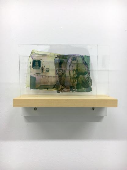 Printed glass featuring an assemblage of found imagery.