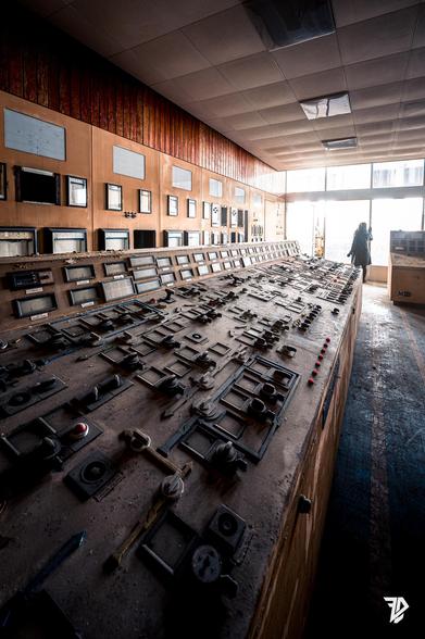 silhouette inside a control room bathed in light