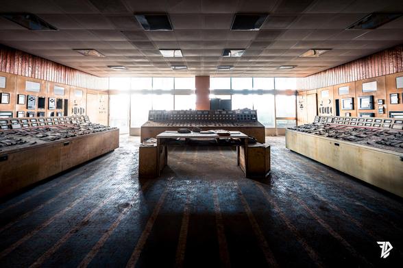  control room with a desk bathed in light