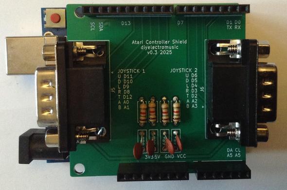 Photo of an Arduino Uno format PCB on an Arduino Uno.  The PCB has two D-type connectors, four resistors and four capacitors.