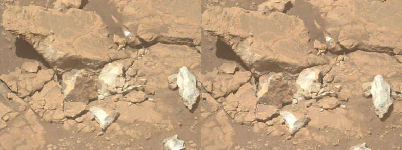 An ochre toned dual left/right stereoscopic image capturing some crushed Martian rocks somewhere on the western edge of the rim of Jezero Crater. This dual image is intended to be used to obtain a Stereo3D rendition of the scene through parallel viewing, and not cross-eyed viewing.