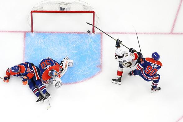 Overhead view of Brad Marchand scoring a goal against the Edmonton Oilers