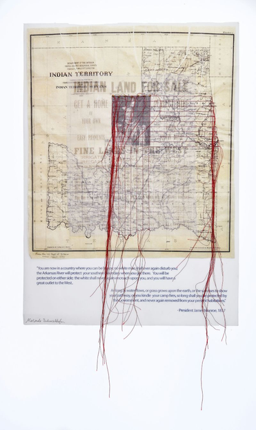 Photo of a quilt by Melinda Schwakhofer - As Long As Grass Grows. A wall quilt with an antique map overlaid with similar aged photo of Native American and trailing long red threads off the edge of the artwork.