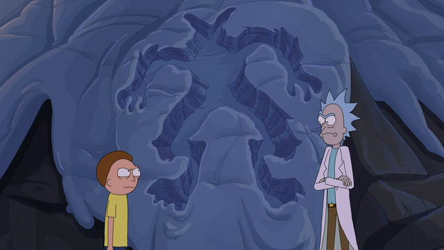 Cena da animação "Rick and Morty" com os personagens Morty e Rick em um ambiente rochoso. Rick está de braços cruzados, observando Morty, que encara Rick de volta. É possível ver a silhueta de uma criatura na neve.