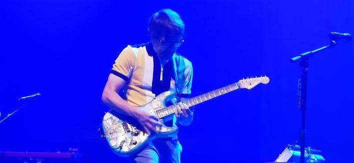 Rivers Cuomo of Weezer playing a guitar solo
