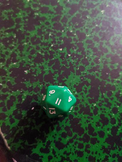a 20 faces dice showing 11