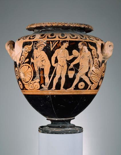 Hermes, Polydeukes, and a satyr old and fat enough to be called Silenos are shown in a scene possibly inspired by a satyr play. Hermes stands at the left, his right leg propped on the tendril of an adjacent palmette. He wears high-laced sandals and a winged helmet and carries his caduceus in his left hand. He looks back to the right at Polydeukes, who stands looking at the egg in his left hand that contains his sister Helen. In his other hand is a mattock, with which he will crack open the egg.…