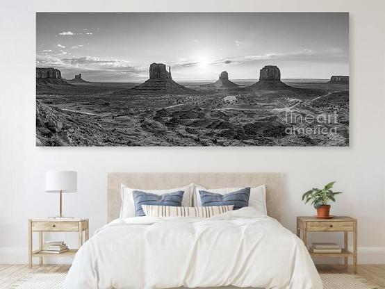 The morning sun bursts some rays through some clouds during sunrise at Monument Valley in at Navajo Tribal Park in northeast Navajo County, Arizona, United States. This beautiful black and white panoramic landscape showcases three silhouetted butte rock formations.
https://5-jennifer-white.pixels.com/featured/monument-valley-panorama-grayscale-jennifer-white.html
#buyintoart #fineart #wallart #homedecor