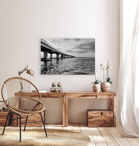 A black and white photograph of a beautiful morning during sunrise at Perdido Pass in Orange Beach, Alabama. This captures beautiful clouds in the sky as the sunrise glows behind some of them just under the bridge. 
https://www.pictorem.com/2392369/perdido-pass-seawall-park-sunrise-grayscale/
#buyintoart #photography #fineart #artgallery