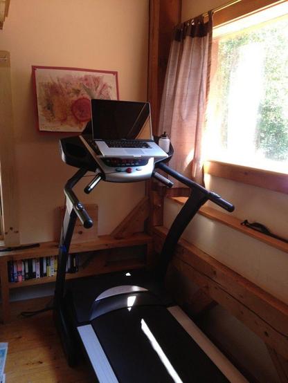 Walking to work: photograph of my home treadmill desk; simply a treadmill with an added shelf for a laptop