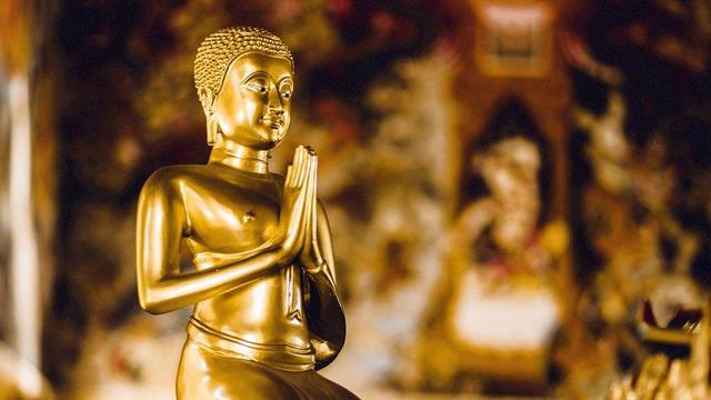Golden statue of Buddhist monastic.