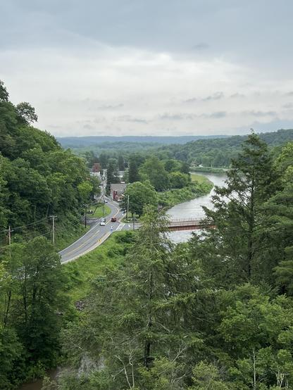 a closeup view of the town, the highway, and the creek. Everything is very green, the sky is heavily overcast, but not raining. (yet) 