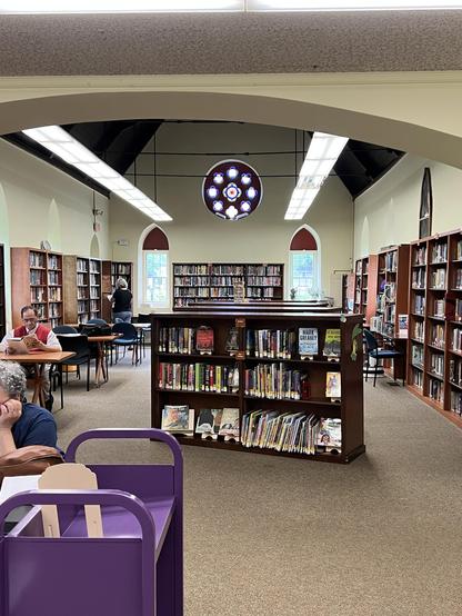 the old chapel building still has a rose window, and under it, two arched windows. Look closely at the window on the left….