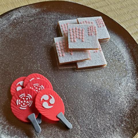 Dried sweets for the Gion Matsuri (some in the shape of fans emblazoned with the festival crests, the other recalling the lanterns hanging from the floats).