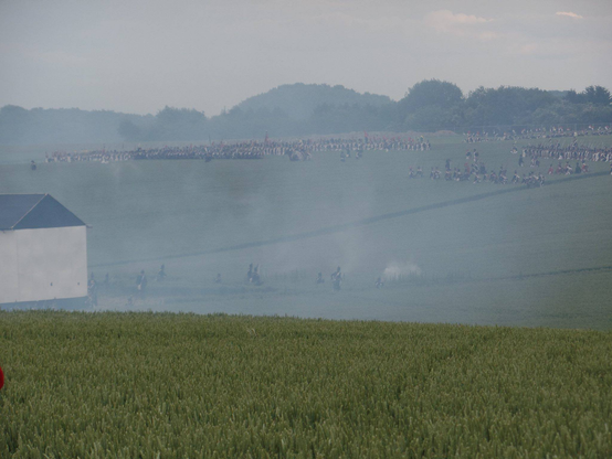 Smoke begins to fill the valley as the French advance