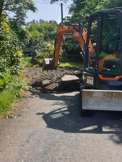 Digging up the road.