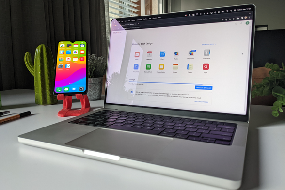 Smartphone and laptop running on /e/OS on a desk next to a cactus