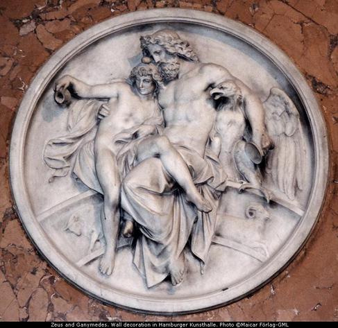 Relief of Zeus and Ganymede. Zeus is seated, one arm around an eagle, the other holding Ganymede, who is just getting off his lap.