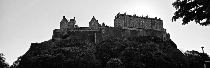 A black and white photograph of Edinburgh Castle.