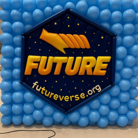A balloon wall featuring the logo of the R package 'future.' The logo is a dark blue hexagon outlined in black, with the word 'FUTURE' in bold yellow-orange letters below a stylized orange comet. Small yellow dots are scattered around the background, and the URL 'futureverse.org' curves along the bottom. The hexagon is surrounded by a grid of light blue balloons.