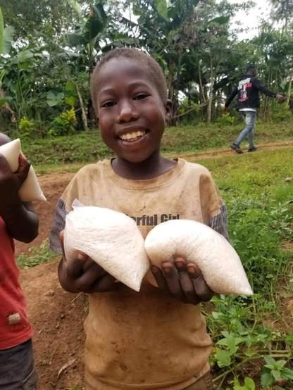 A smile on a child's face after getting what to eat. 