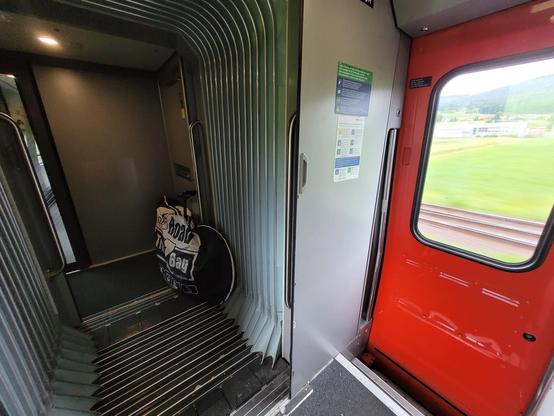 Packed bicycle near the entrance inside an ICN train within Switzerland to reach Neuchâtel.