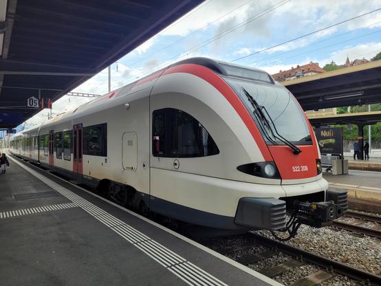 Swiss regional train on a platform in Neuchâtel ready for its cross-border trip.