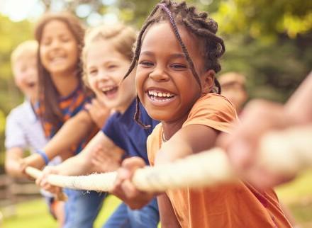 Children having fun playing tug of war 