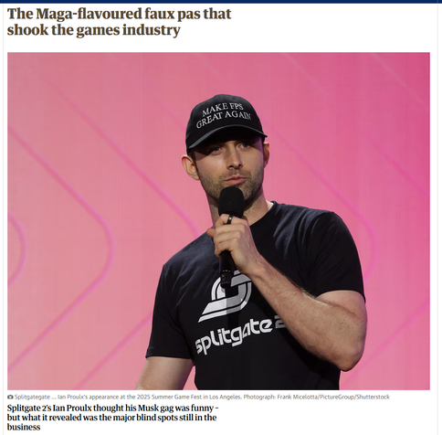 The image features a man standing on a stage, holding a microphone. He is wearing a black t-shirt with the logo "Splitgate 2" on it, and a black cap with the text "MAKE FPS GREAT AGAIN" in white letters. The background is a solid pink color with a subtle pattern. The man appears to be speaking, as he is holding the microphone close to his mouth. The image is accompanied by a headline that reads, "The Maga-flavoured faux pas that shook the games industry." Below the image, there is a caption that reads, "Splitgate 2's Ian Proulx thought his Musk gag was funny - but what it revealed was the major blind spots still in the business." The photograph is credited to Frank Micelotta from PictureGroup/Shutterstock.