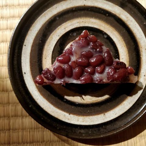 A triangular sweet known as minatsuki. Eaten in the summer months, it is designed to resemble a slice of ice and thus help us think cooling thoughts.