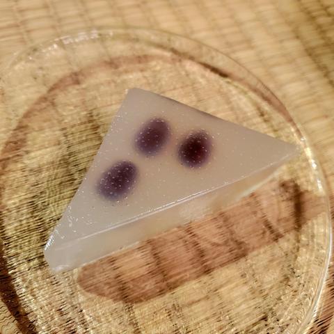 A triangular sweet known as minatsuki. Eaten in the summer months, it is designed to resemble a slice of ice and thus help us think cooling thoughts.