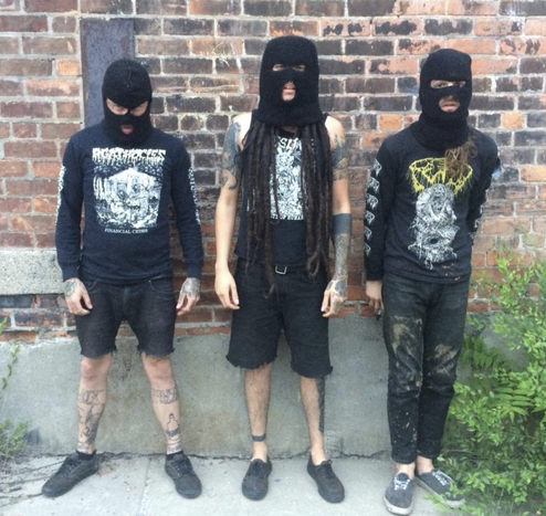 the trio wearing black, with matching balaclava, looking like they slept in a ditch...  