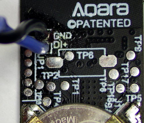 Aqara door and window sensor with external switching modification, twisted pair soldered to ground/direct labelled pads