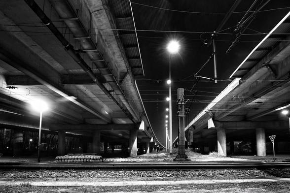 Nighttime wasteland, 
no taxi anywhere, 
lost in a landscape of concrete and loneliness.
