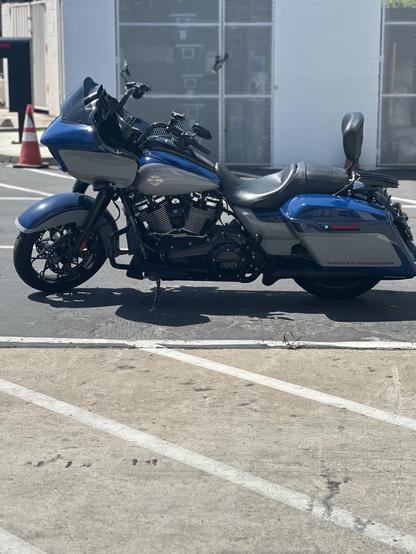 Beautiful blue and grey motorcycle that you wish you could ride. 