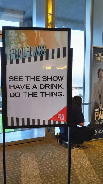 Sign at a pre-show event by CTGLA that reads: "PREMIERE PASS: SEE THE SHOW. HAVE A DRINK. DO THE THING."