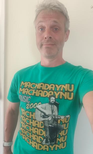 A Music 2000 Machadaynu t-shirt in green, featuring Tony Rudd. If you know, you know.