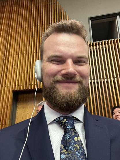 Seth with the translator device on his ear