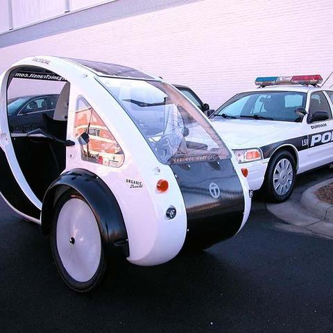 pic:

TACTICAL ELF

Organic Transit’s Tactical ELF, which is a CLass 3 E-Bike, gives you the advantage for community policing, events management, corporate and academic campus maintenance and grounds, and any situation where you need all-day performance! With heavy payload capabilities, comfort, visibility and more, the Tactical ELF is a great resource. The Tactical ELF is available in 2FR models.

Specifications:

    Body: Trylon Composite sides, carbon fiber panels, and scratch-resistant front and rear windshields
    Frame: Aircraft alloy 6061T with stainless steel hardware
    Drivetrain: 1250W permanent magnet motor with Cycle Analyst display and NuVinci® continuously variable transmission
    Power: Two 16Ah 48V Lithium-ion NMC battery packs and a 100W marine-grade flexible solar panel
    Brakes: Avid BB5 disc brakes on all wheels
    Lighting: Full LED lighting, 250 lumen headlights (x2 for a total of 500 lumens), tail lights, turn signals, and brake lights, capable of supporting police security, emergency, and warning light bars
    Electrical outputs: USB and 12V power ports
    Weight: Curb weight 205 lbs., 550 lb. payload (rider plus cargo)
    Seating: Ergonomic recumbent seat designed for prolonged seating, fits riders from 5’0″ to 6’9″ tall
    Storage: Large lockable trunk, weight-bearing trunklid, and front parcel tray
    Range: 45 miles without pedaling (using electric motor only)
    Top speed using electric motor only: 28MPH
    Emissions: ZERO

