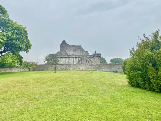 Craigmillar castle from afar on a gray day