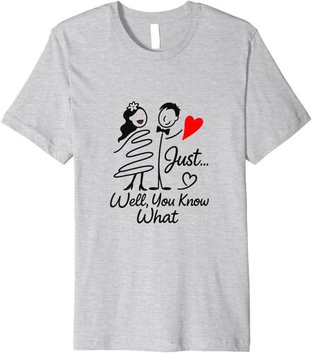 Five t-shirts in different colors (white, light blue, gray, pink, and white) featuring a hand-drawn design of a couple holding a red heart, with the text 'Just... Well You Know What' in black. The designs are displayed against a plain background, available for purchase on Amazon Fashion, Amazon Merch, and Fine Art America.