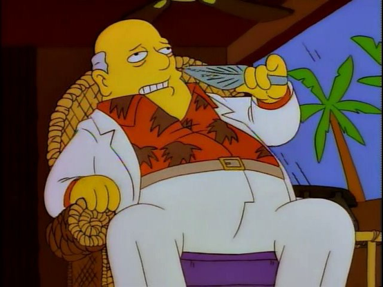 A heavy-set man in a white suit (with an orange shirt) in a tropical climate (there’s a palm tree in the background). It’s a still from The Simpsons where he reveals too much information about Kristy the Clown’s bank account.