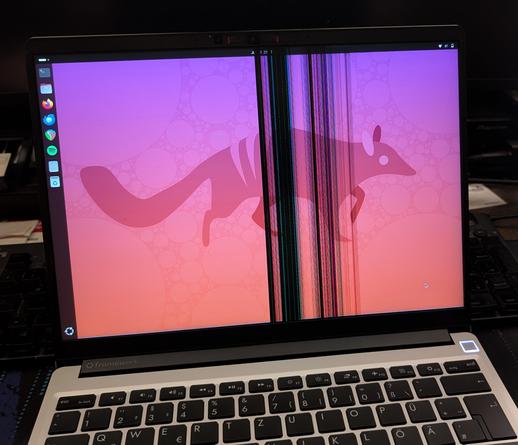 A Framework 23 inch laptop with a broken LCD screen panel.