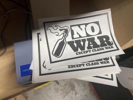 Stickers that say “No War except Class War”.