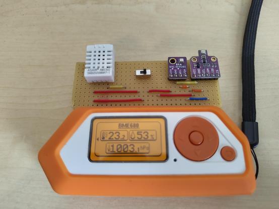 Flipper Zero with DIY board with DHT22, BME280 and BME680 sensors, with switch between DHT22 and BME280/BME680, showing the measurements of the BME680 sensor.
