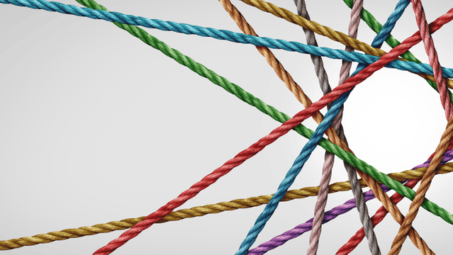 An image of colored threads on a white background.